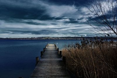 Pier over sea against sky