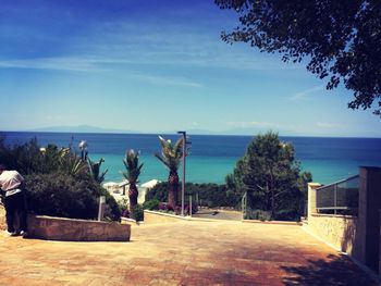 View of swimming pool by sea against sky