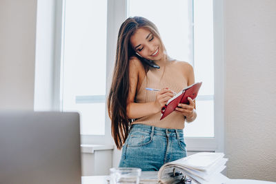 Young woman using smart phone