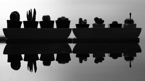 Low angle view of silhouette built structure against sky