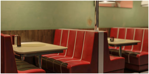 Empty chairs and table in cafe