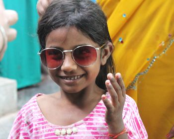 Portrait of smiling girl wearing sunglasses