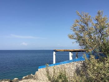 Scenic view of sea against clear blue sky