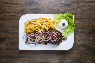 High angle view of vegetables in plate on table