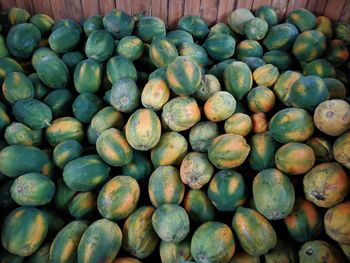 High angle view of papayas for sale at market stall