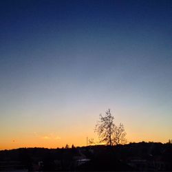 Built structure against clear sky at sunset