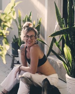 Portrait of smiling woman sitting outdoors