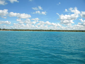 Scenic view of sea against cloudy sky