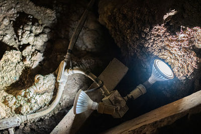 High angle view of man working on rock