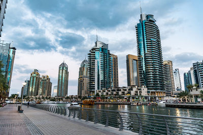 Modern buildings in city against sky
