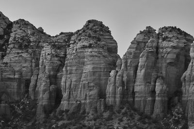 Low angle view of rock formation against clear sky