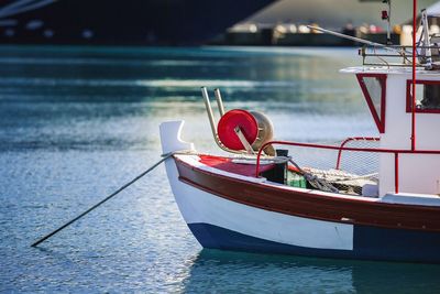 Boat moored on sea against sky