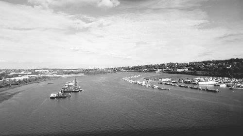 High angle view of harbor by sea against sky