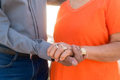 Senior couple holding hands together