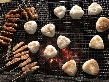 High angle view of meat on barbecue grill