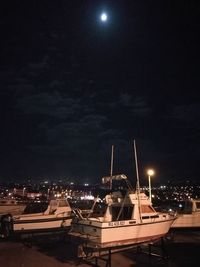 Illuminated city against sky at night