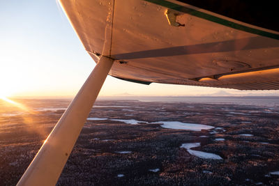 Aerial view of landscape seen through airplane window