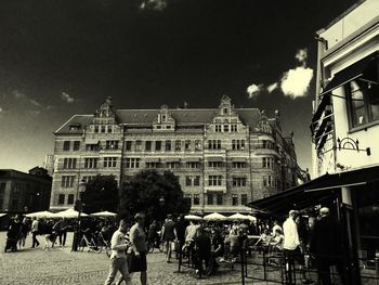 People walking in front of building