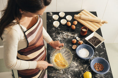 High angle view of woman preparing food at home