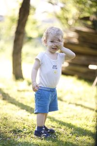 Full length of young woman exercising in park