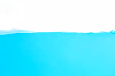 Full frame shot of blue sea against white background