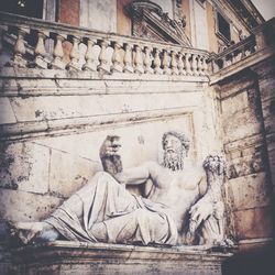 Low angle view of statue against building