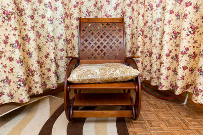 Wooden rocking chair in the room