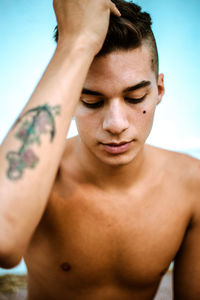 Close-up of young man looking away