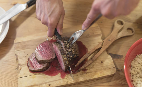 Cutting steak at home.