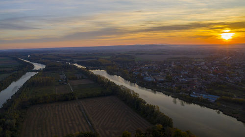 High angle view of buildings against sky during sunset