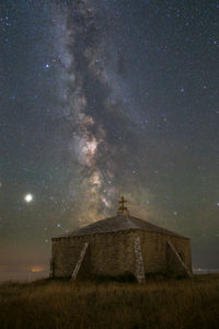 Low angle view of building against sky at night