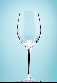 Close-up of wineglass against white background