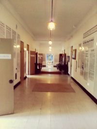 Illuminated lights on tiled floor in building