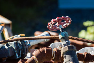 Close-up of rusty chain on railing