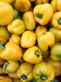 Full frame shot of yellow bell peppers at market stall