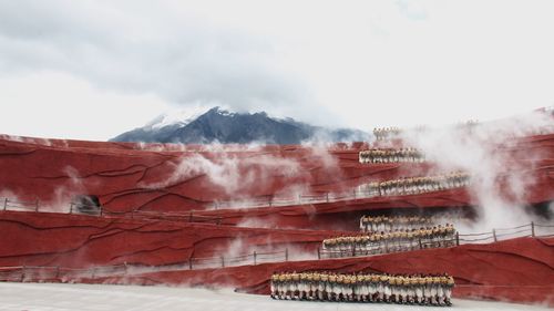 Panoramic view of mountains against sky during winter