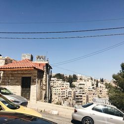 Buildings in city against clear sky