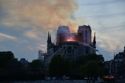 View of burning building in city