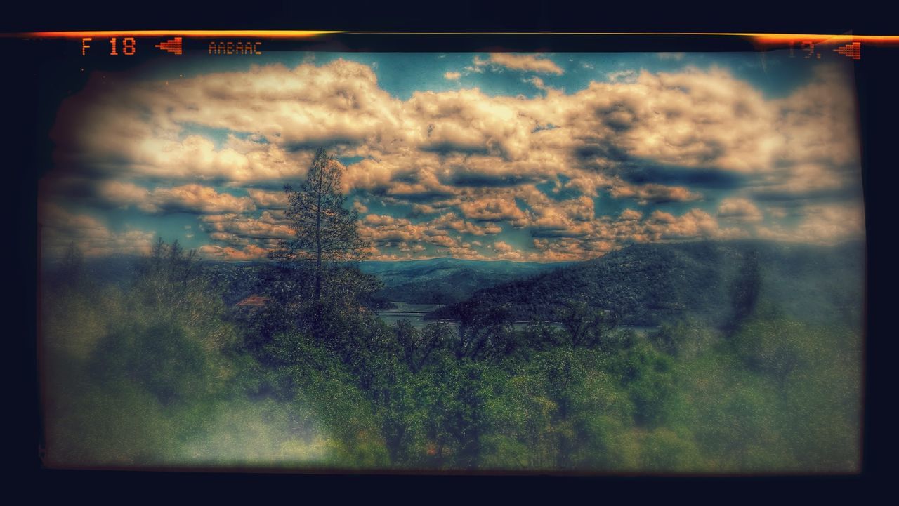 sky, cloud - sky, transfer print, cloudy, auto post production filter, tranquil scene, scenics, tranquility, beauty in nature, cloud, nature, weather, landscape, sunset, dramatic sky, overcast, tree, idyllic, mountain, outdoors