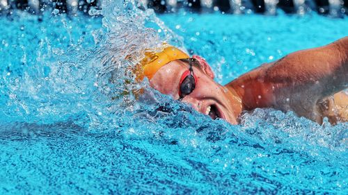 Portrait of man swimming in pool