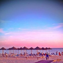 Scenic view of beach at sunset