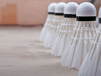 Close-up of shuttlecocks arranged on table