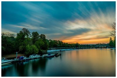 Scenic view of lake against sky during sunset