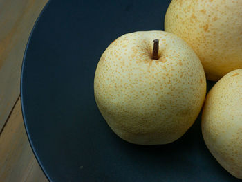 High angle view of apple in plate on table