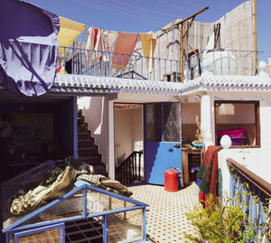 Potted plants on balcony against building