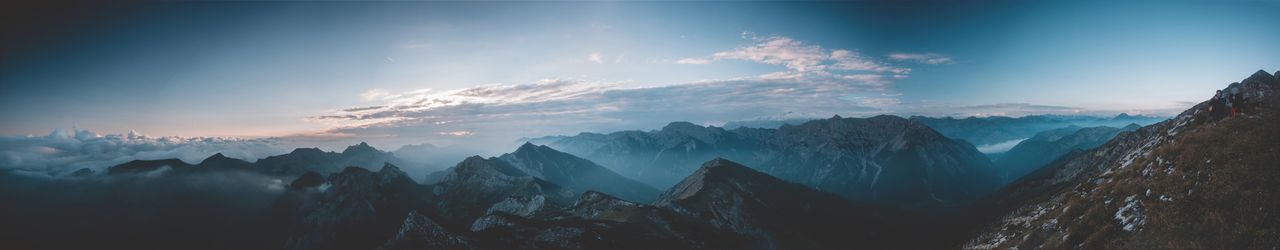 Panoramic view of mountains against sky during sunset