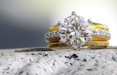 Close-up of wedding rings on table