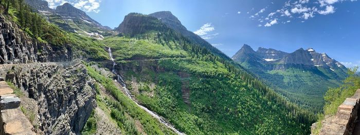 Panoramic view of land and mountains against sky