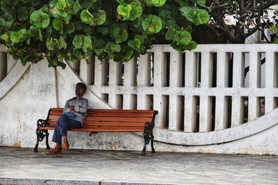 Woman sitting on bench