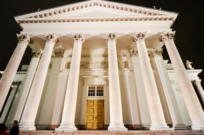 Facade of cathedral against sky at night